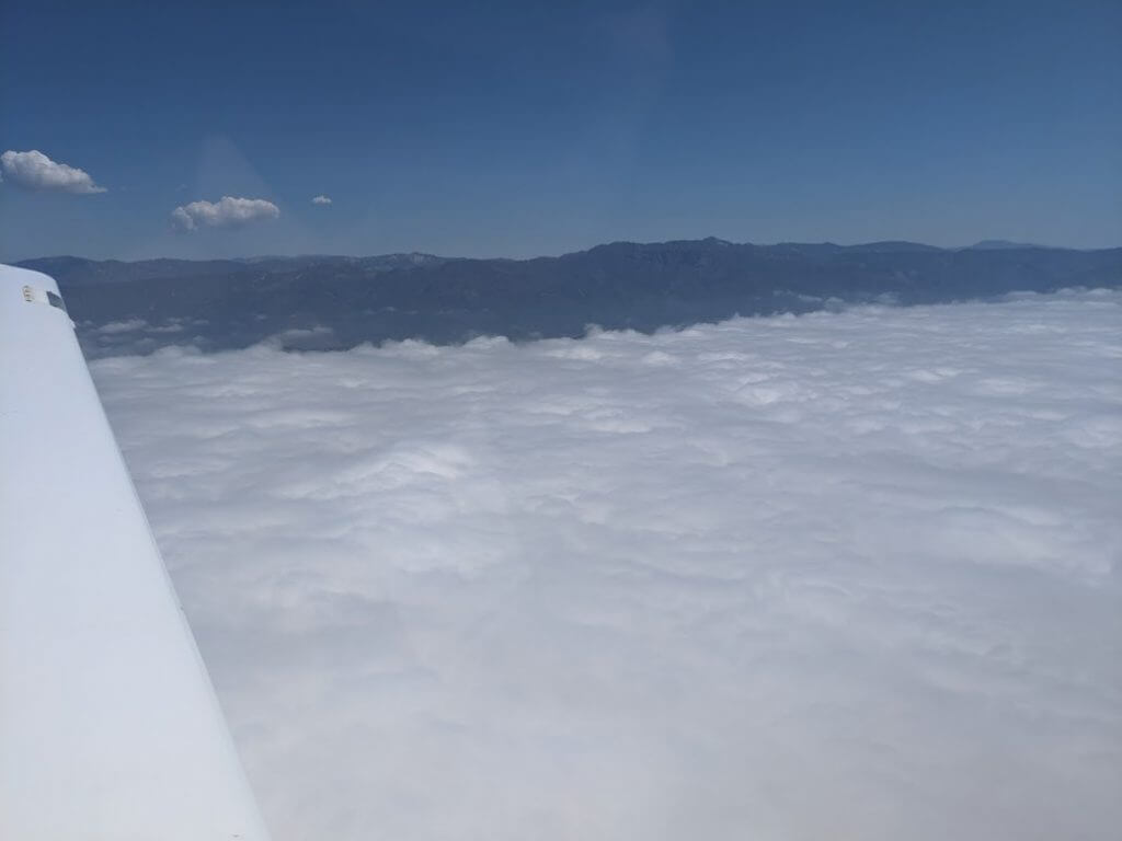  Above the clouds. Gloomy overcast below, sunny above! 