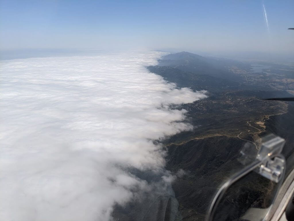  Mountains blocking stratus clouds from the marine layer from moving into the central valley 